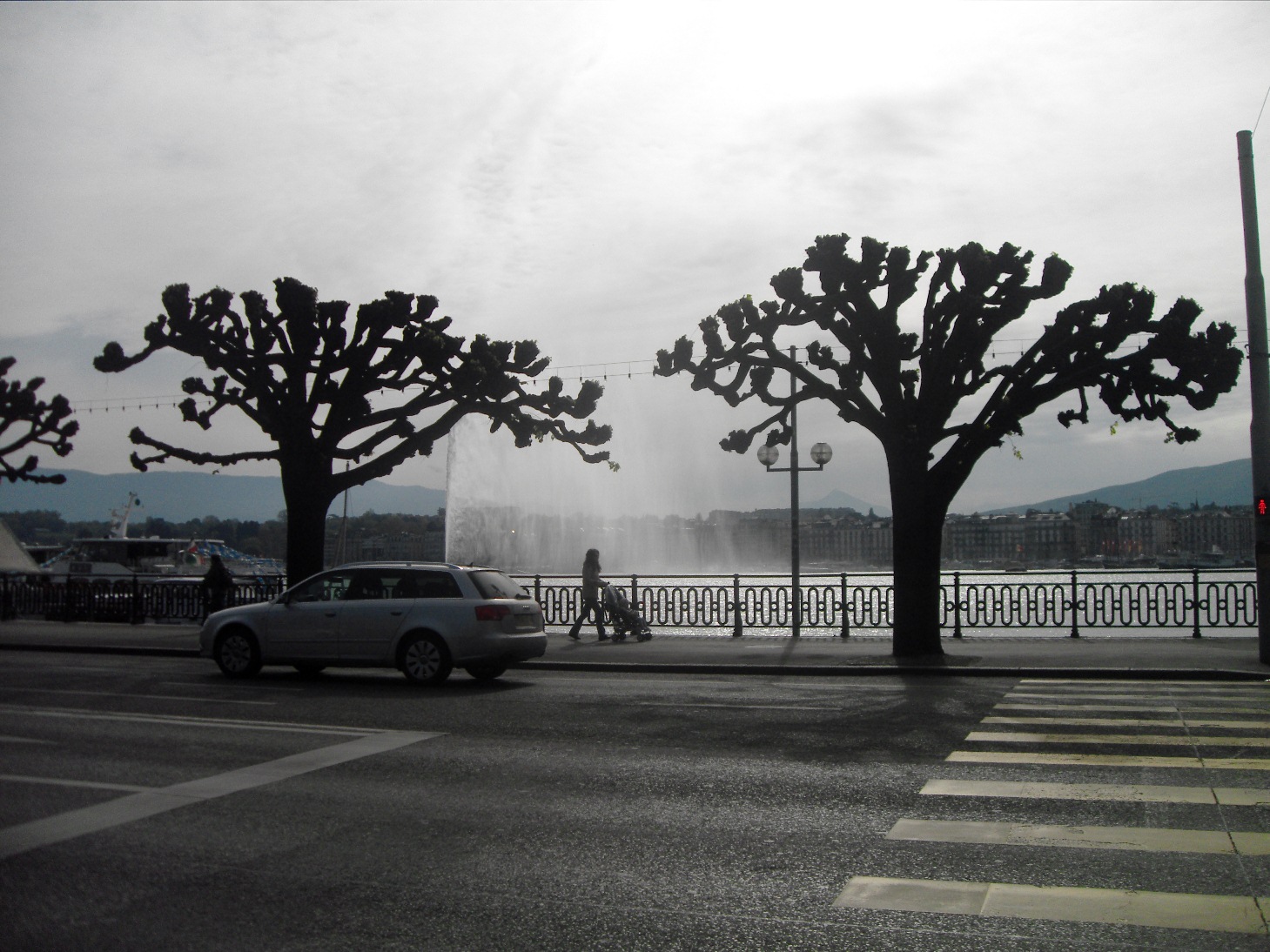 View of Jet d'Eau while crossing the street View of Jet d'Eau while crossing the street